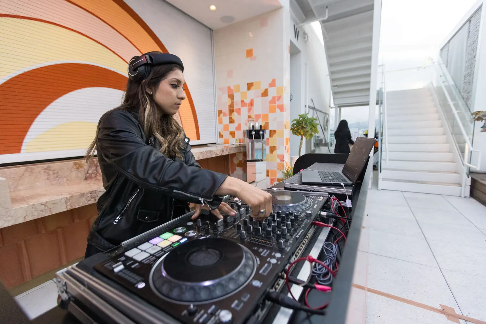 DJ performing on turntables at the Edge 2025 rooftop event, photographed by Marquee Visuals in Los Angeles.
