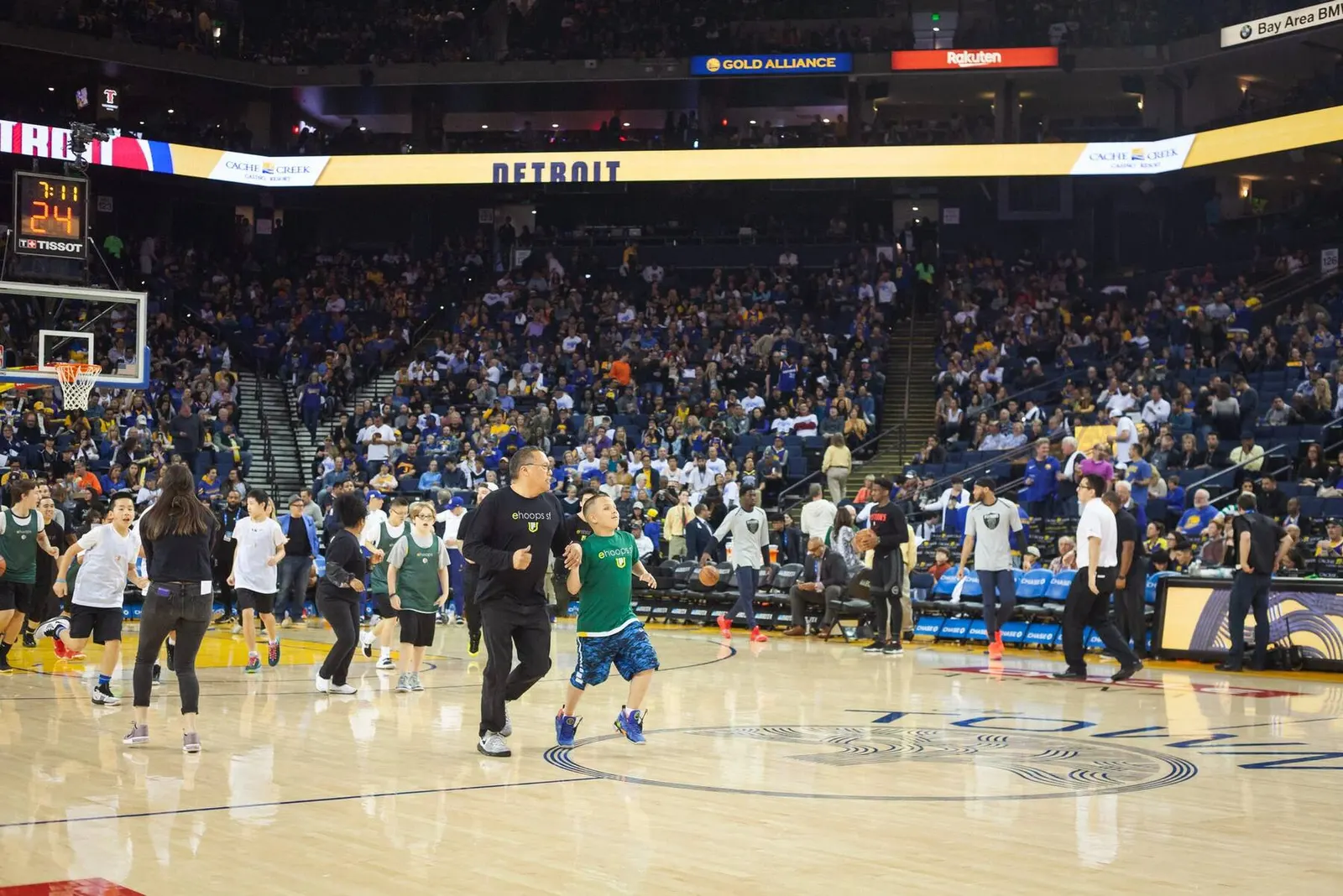 Wide view of players on the basketball court at Oracle Arena during an esports event, photographed by Marquee Visuals.