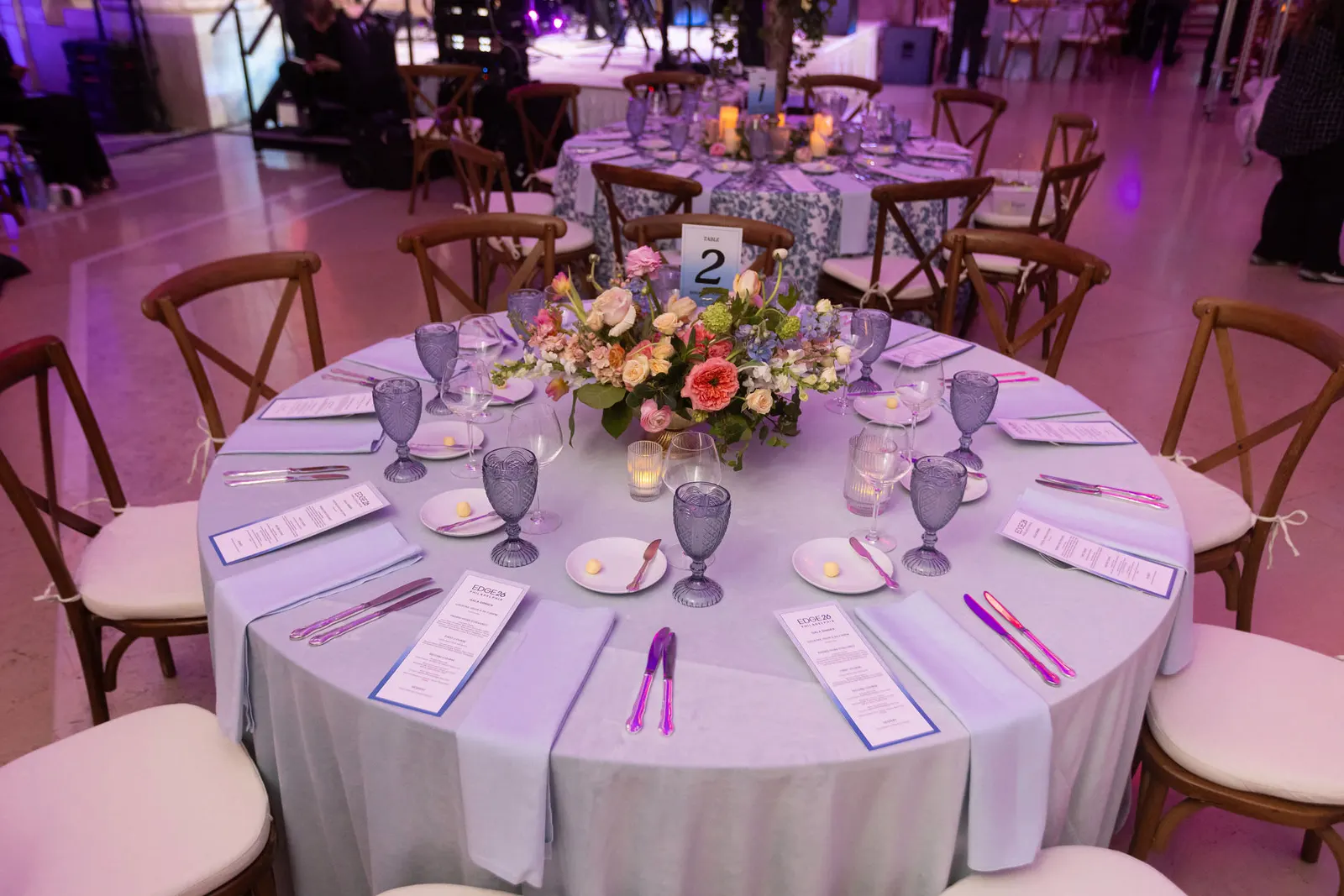 Elegant round gala table setting with lavender and purple decor at the Tiger Gala 2026, photographed by Marquee Visuals.